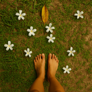 Pieds nus sur herbe avec fleurs blanches éparses